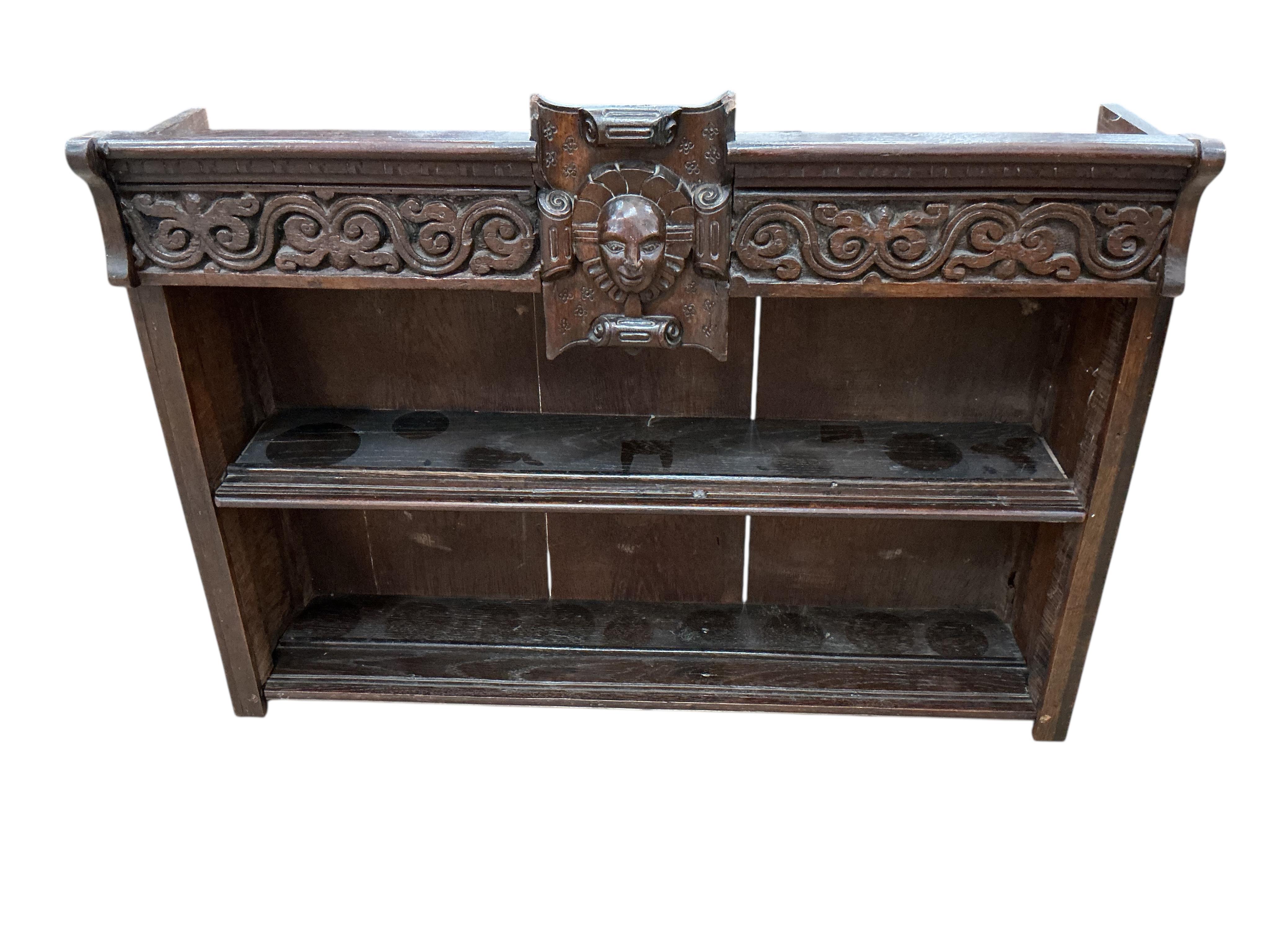 An 18th century style carved oak wall bracket, width 88cm, depth 22cm, height 66cm